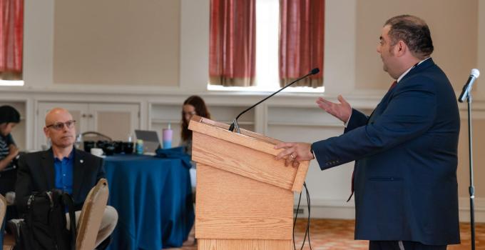 Keynote speaker, Dr. Charles Tahan, speaks at the PQI 2022 event.