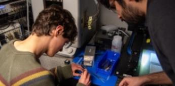 students working with advisor