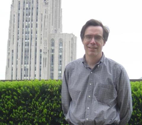 David Waldeck stands in front of Cathedral